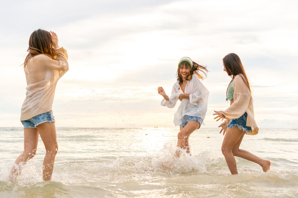 Friends enjoying a girls’ weekend getaway at the beach